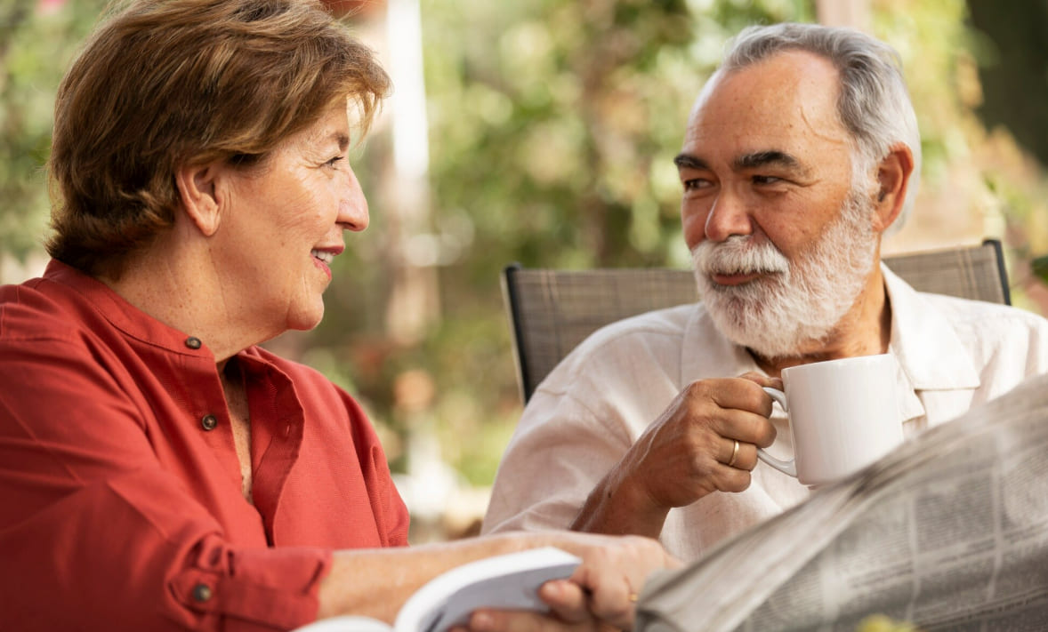 Older couple enjoying a quiet conversation outdoors