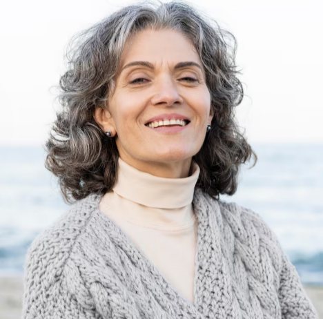 Senior woman smiling in profile style portrait